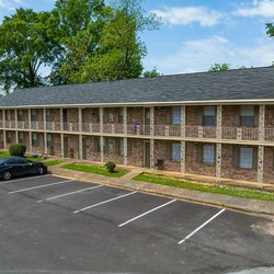 panoramic view of the parking lot at Woodlawn Manor, located in Tuscaloosa, AL